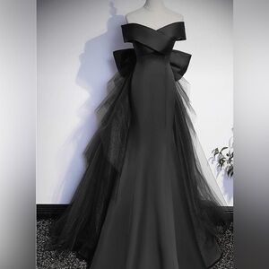 Black strapless mermaid gown with bow & tulle train